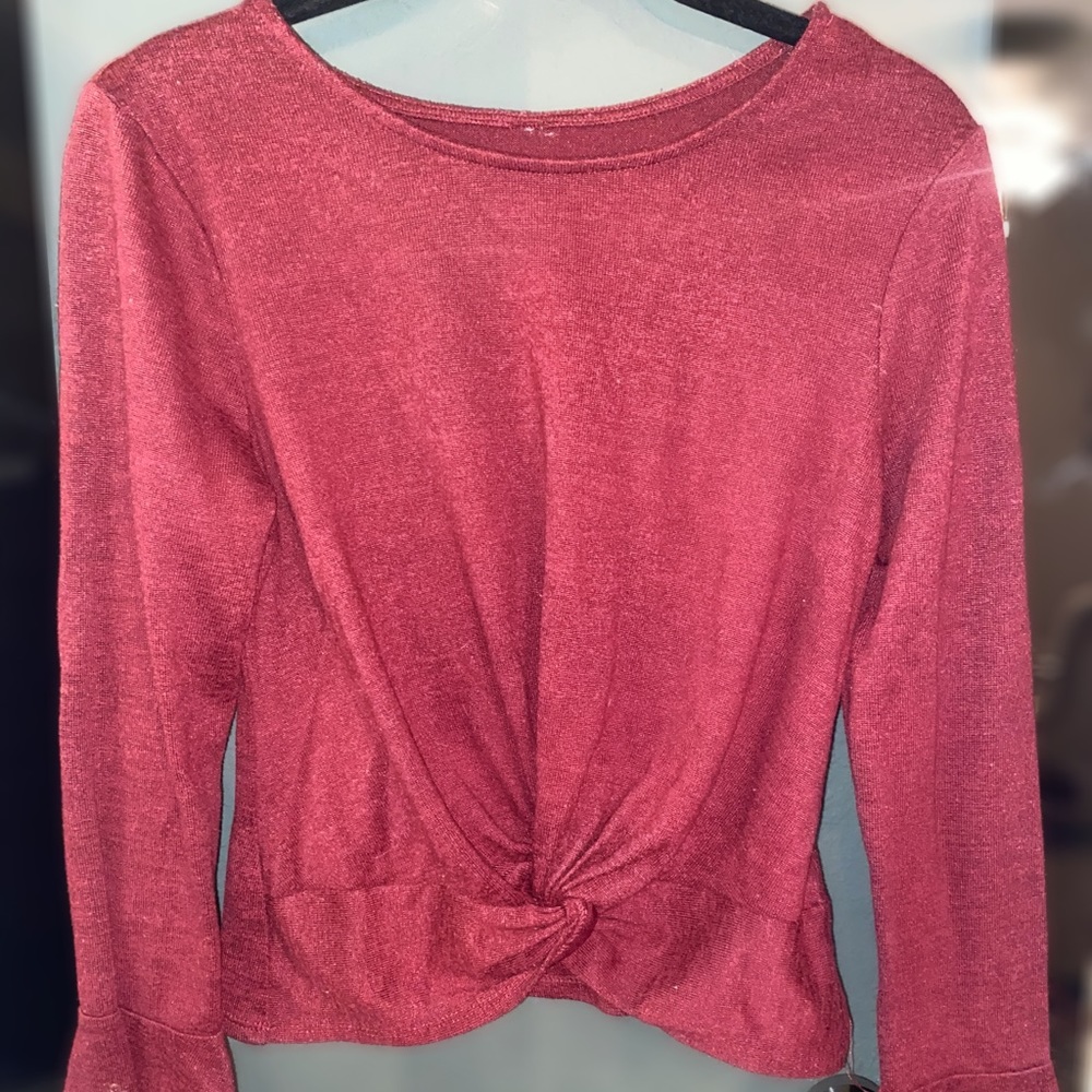 Burgundy long sleeve top.